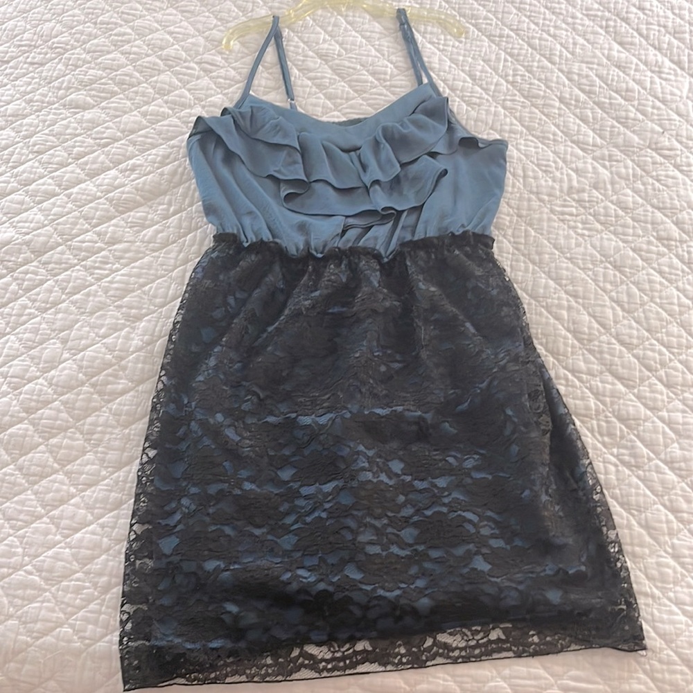 Size M. Black lace dress with blue underlay.